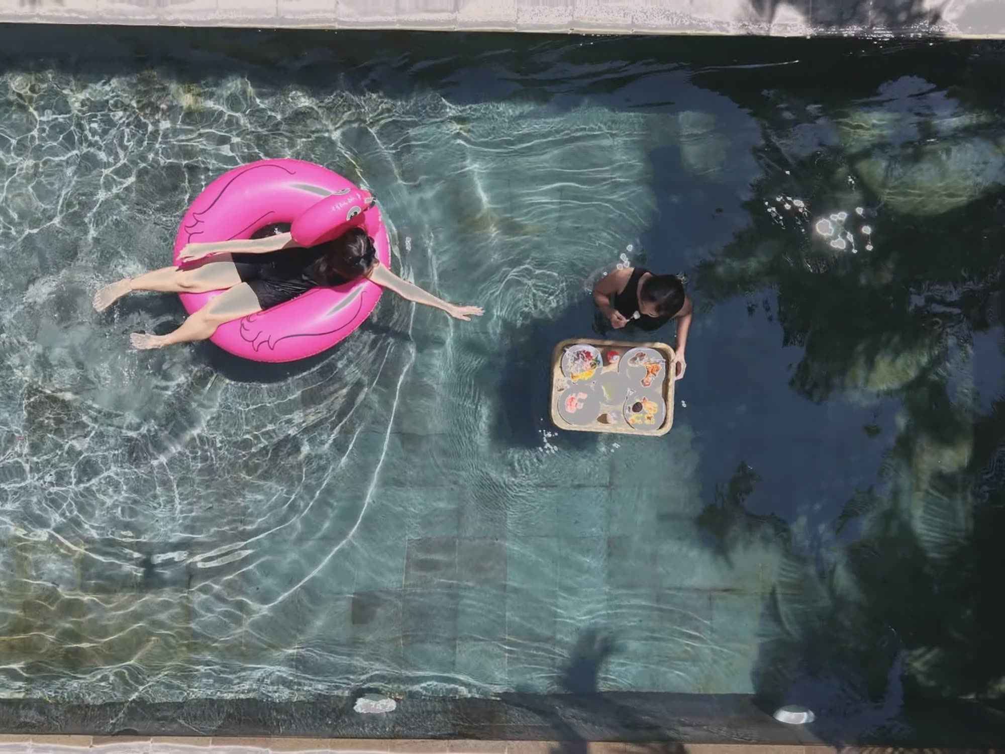 Afternoon tea served at the edge of a private pool